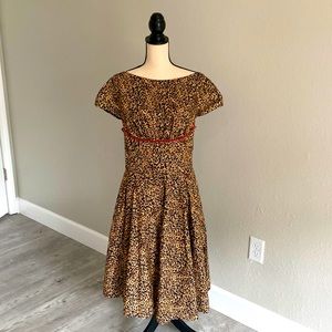 Retro/pinup style leopard print dress with red piping